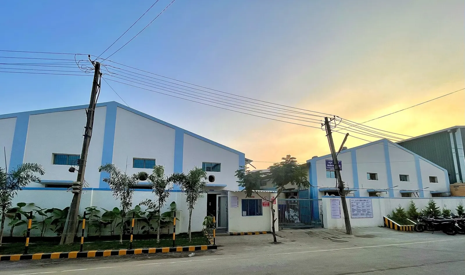 Afnosh Packaging Industries manufacturing facility exterior at dusk